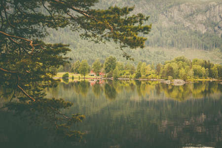 Norwegian country house in the mountains. Beautiful coastline fjords landscape in Norway, Scandinavia Europeの写真素材