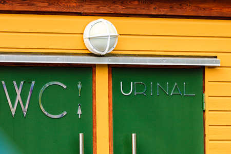 An entrance to the male and female public toilet outdoor, WC restroomの写真素材