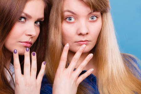 Look results of using cosmetics. Portrait of two girls one with and second without make up. Comparison of natural and cosmetical beauty of women.の写真素材