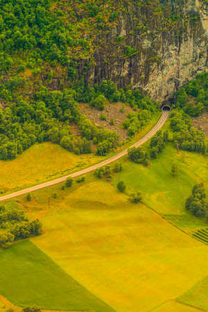 Tunnel entrance at the norwegian green summer mountains, Norway Scandinaviaの写真素材