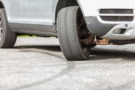 Detailed close up of twisted car wheel, automobile vehicle machine details concept.の写真素材