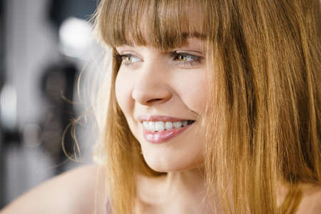 Happiness face expressions concept. Portrait of happy cheerful blonde woman smiling with joyの写真素材