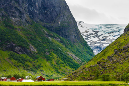 Tourism vacation and travel. Mountains landscape at summer with beautiful grren valley, Stryn...