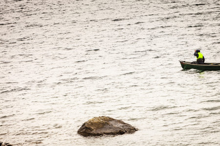 Tourism vacation and travel. People kayaking in lake, Haukeli in summer, Norway.