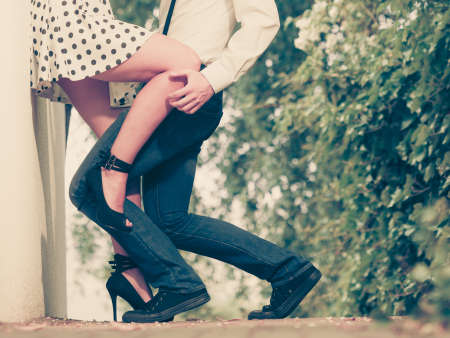 Summer holidays love relationship and dating concept - romantic playful couple retro style flirting outdoorの写真素材