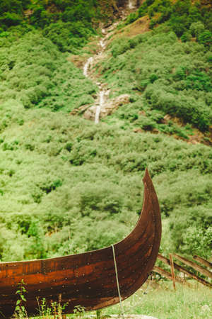 Part of old wooden viking boat in norwegian nature. Tourism and traveling conceptの写真素材