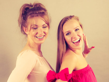 Happy positive female friends having fun enjoying their feminine leisure time. Friendship concept.