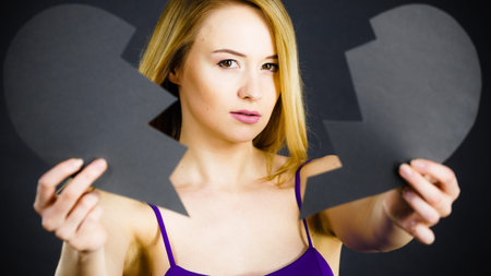Depression, sadness, relationship problem concept. Young female with broken heart full of negative...