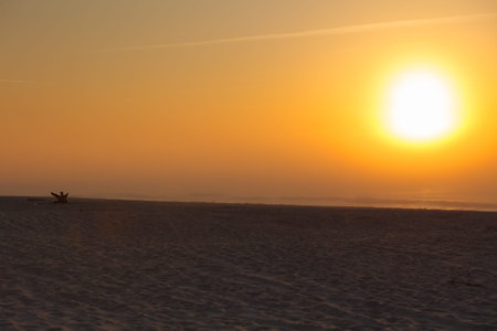 Amazing colorful red sunset over evening sea horizon. Tranquil scene. Natural background. Landscape.の写真素材