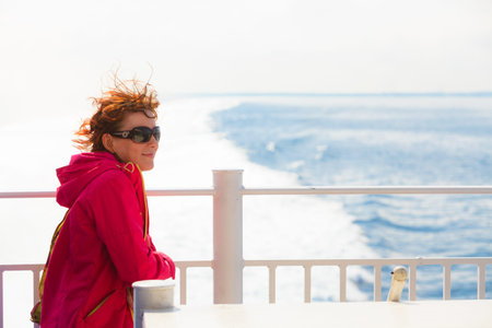 Travel holiday and tourism. Tourist woman on cruise ship boat enjoying open ocean view, seascape...