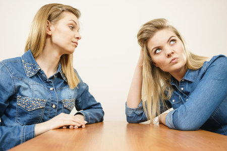 Two women having argue mocking up being mad at each other. Female telling off, ignorance concept.