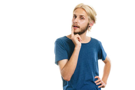 Young man confused thinking seeks a solution. Decision making process, doubt concept, studio shot isolated on whiteの写真素材