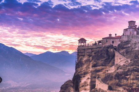 Scenic sunset evening sky over holy Varlaam monastery on cliff in Meteora, Thessaly Greece. Greek...