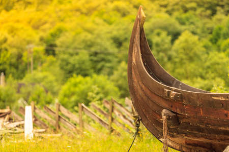 Part of old wooden viking boat in norwegian nature. Tourism and traveling conceptの写真素材