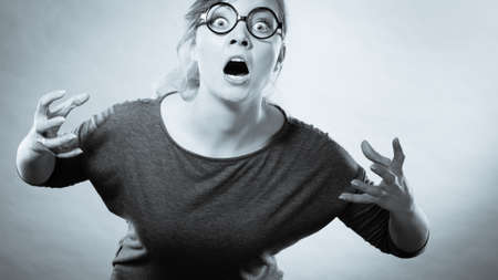 Psychology frustration emotions feelings concept. Furious woman yelling. Nedry girl angered frustrated screaming out of wrath.の写真素材