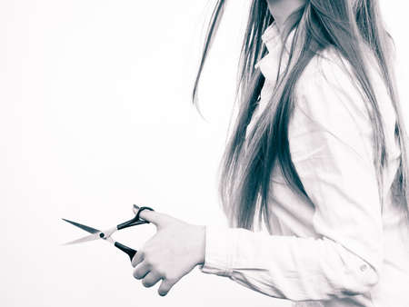 Cutting and trimming. Haidressser with vision of new look her client. Professional woman hairdresser barber with scissors make change cut hair.の写真素材