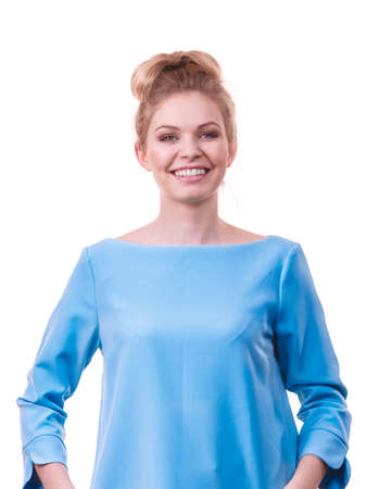 Happy adult woman presenting her casual beautiful outfit, long sleeved blue top.の写真素材