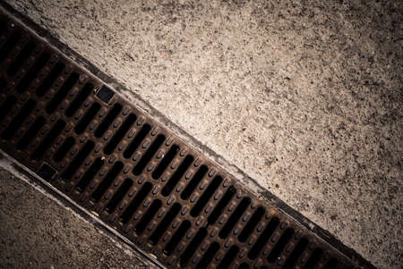 Detailed close up of drainage grille in ground. Urban city details concept.の写真素材
