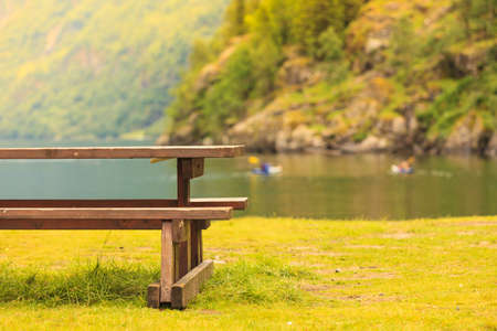 Picnic site wooden table and benches in norwegian nature, Europe.の写真素材
