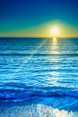 Scenic sunset or sunrise over sea surface. Natural scenery, beautiful landscapeの写真素材