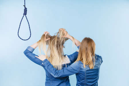 Woman trying to help her best friend with suicidal thoughts. Friendship and depression concept.の写真素材