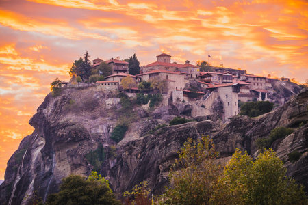 Scenic sunset evening sky over holy Varlaam monastery on cliff in Meteora, Thessaly Greece. Greek...
