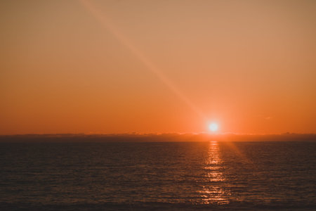 Scenic sunset or sunrise over sea surface. Natural scenery, beautiful landscape