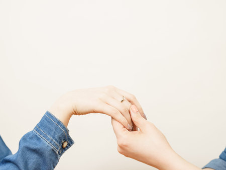 Woman showing her female friend engagement ring sharing great news. Family beginnings concept.