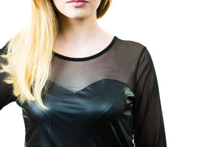 Young blonde fashionable pretty woman wearing black leather top. Female being fashionable.の写真素材