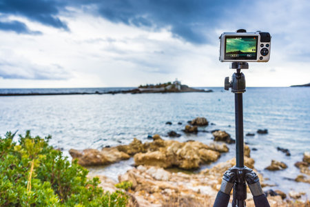 Camera taking picture film video from cemetery on sea shore in Agios Fokas near Monemvasia, Laconia...