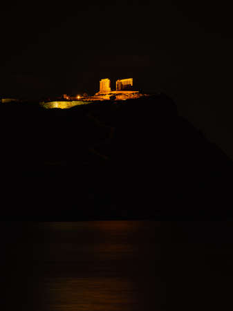 Night scene ruins of an ancient temple of Poseidon, Greek god of the sea. Greece Cape Sounion.のeditorial素材