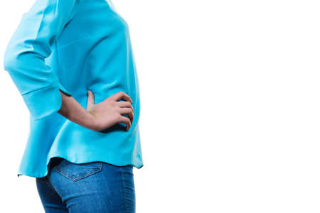 Unrecognizable woman presenting her casual beautiful outfit, long sleeved blue top and jeans.の写真素材