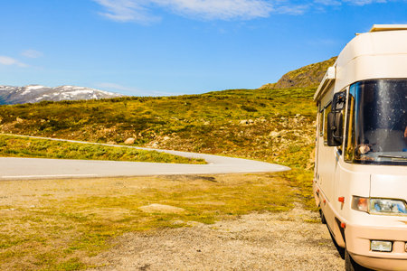 Tourism vacation and travel. Camper van in summer mountains landscape. National tourist route...
