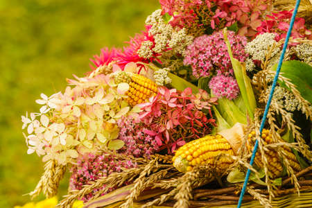 Decorative bouquet made of field flowers and hay. Folk decorations conept.の写真素材