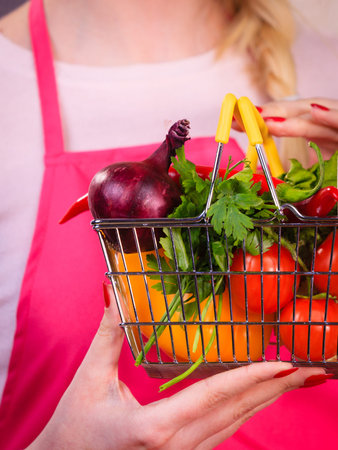 Shopping basket with many colorful vegetables. Healthy eating lifestyle, nutrients vegetarian food.の写真素材