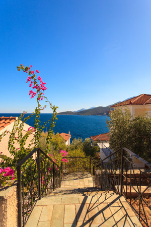 View from high angle on houses roofs in seaside greece town. Greek, Mediterranean architecture.
