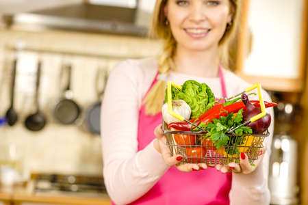 Shopping basket with many colorful vegetables. Healthy eating lifestyle, nutrients vegetarian food.の写真素材
