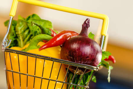 Shopping basket with many colorful vegetables. Healthy eating lifestyle, nutrients vegetarian food.の写真素材
