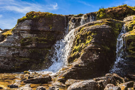 Mountain waterfall. Scenic region between Aurland and Laerdal in Norway. National tourist route Aurlandsfjellet.の写真素材