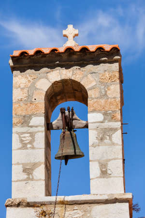 Detail of architecture stone traditional belfry bell tower in Vathia old town, Mani Peloponnese Greece. Architectural theme.の写真素材