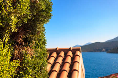 View from high angle on houses roofs in seaside greece town. Greek, Mediterranean architecture.の写真素材