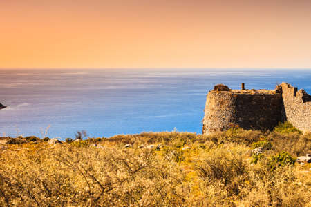 Greek castles. The castle of Kelefa and sea bay of Oitylo in the background, Mani, Laconia, Greece.の写真素材
