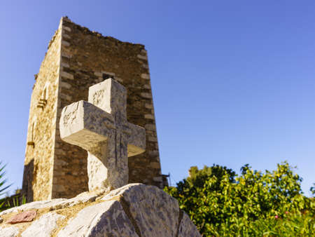 Greek stone cross and tower house, greek architecture, Vathia Mani Greeceの写真素材