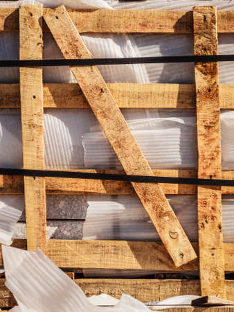 Detailed close up of industrial wooden pallets, outdoor shot on sunny day.の写真素材