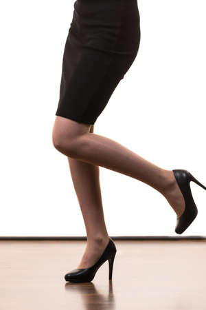 Unrecognizable woman wearing dress or skirt and black elegant fashionable high heels.の写真素材