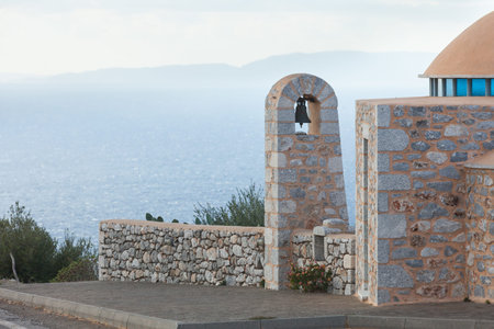 Detail of architecture stone traditional belfry bell tower, Peloponnese Greece. Architectural theme.