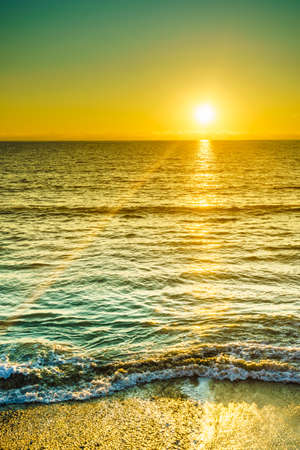 Scenic sunset or sunrise over sea surface. Natural scenery, beautiful landscapeの写真素材