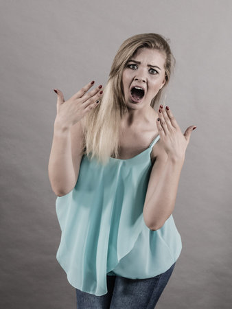 Very scared bad suprised woman seeing something disgusting or unpleasant. Shocked terrified female.