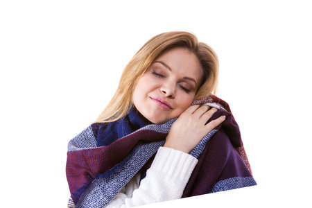 Woman feeling comfortable wearing her soft colorful warm autumnal shawl scarf. Autumn outfit accessories concept.の写真素材