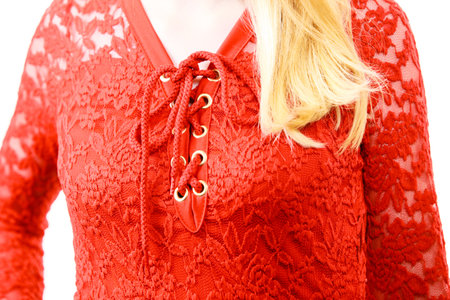 Elegant young woman wearing red lace top. Female presentig stylish fashionable outfit.の写真素材